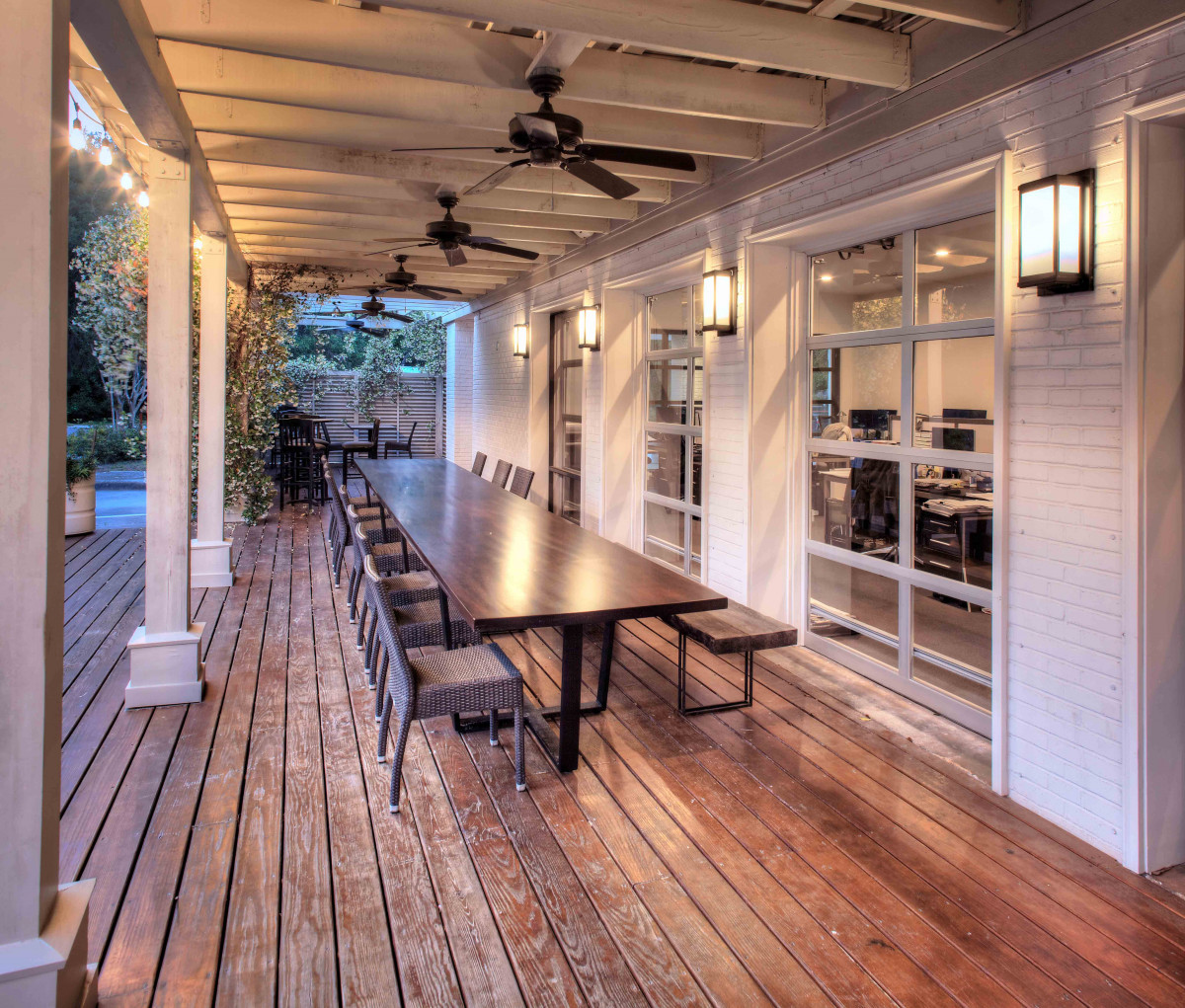 The original 17-foot mahogany bar was repurposed into a gathering table.